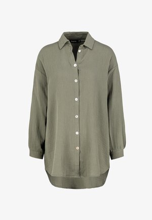 Olive green button-up shirt with a textured fabric, a collared neckline, seven buttons down the front, and long sleeves with buttoned cuffs.