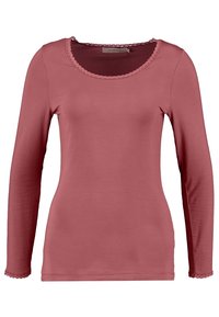 Långärmad topp i dammig ros, tillverkad av mjukt tyg. Har en rundad halsringning med scalloped kant och matchande scalloped ärmslut.