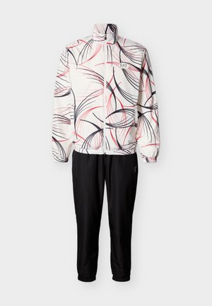 White zip-up jacket with abstract red and black lines paired with plain black pants, both with elastic cuffs and EA7 logo on chest and thigh.