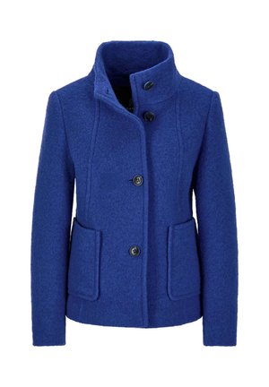 Manteau en laine bleu avec un col montant, des boutons à l'avant et deux poches latérales. La texture est douce, avec une coupe ajustée et des coutures visibles.