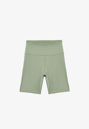 Lichtgroene hoge taille fietsbroek gemaakt van rekbaar materiaal, met een zachte textuur en minimale stikdetails.