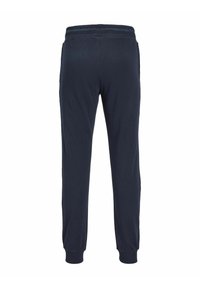 Marina blå joggerbyxor i mjuk bomull, med resårmidja, ribbade muddar och två sidofickor. Slät textur med en avslappnad design.