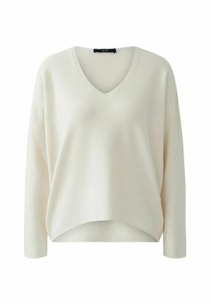 V-Ausschnitt, langärmeliger Pullover aus cremeweißem Rippstrickstoff. Lockere Passform mit asymmetrischem Saum und strukturierter Oberfläche.