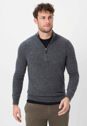 Grauer Reißverschluss-Pullover mit strukturiertem Finish und helleren Farbklecksen. Figurbetonter Schnitt mit gerippten Bündchen und Saum.