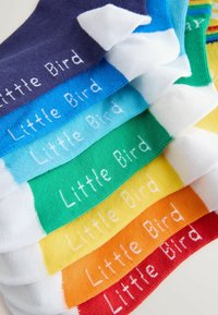 Colorful cotton socks in various shades: navy, blue, green, yellow, orange, and red. Each pair features white "Little Bird" text.