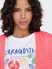 Coral knit cardigan over white t-shirt featuring a colorful seafood graphic, including lobster and shells, with playful typography.