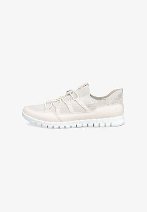 Light beige athletic shoe made of mesh and synthetic material, featuring elastic laces, a textured sole, and a minimalist design.