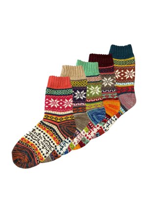 Cinco calcetines tejidos de colores con patrones de copos de nieve y geométricos en varios colores, dispuestos en forma de abanico sobre fondo blanco.