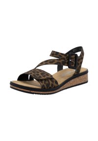 Sandale à motif léopard avec des lanières croisées, une boucle noire, une semelle en liège et un pied de chaussure texturé pour le confort. Semelle en caoutchouc plate pour une meilleure traction.
