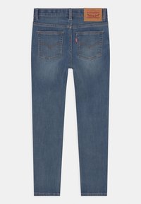 Mörkblå denimjeans med slim fit. Har bakfickor och en märkesläderlapp i midjan. Slät textur, rak ben-design.