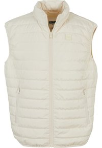Weste in Off-White mit hohem Kragen, Reißverschluss vorne und zwei Seitentaschen. Verfügt über eine gesteppten Textur und dezente Markenkennzeichnung.