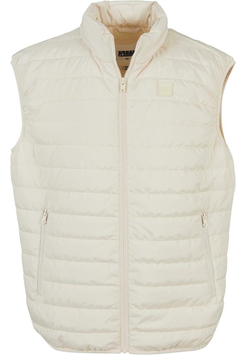 Weste in Off-White mit hohem Kragen, Reißverschluss vorne und zwei Seitentaschen. Verfügt über eine gesteppten Textur und dezente Markenkennzeichnung.