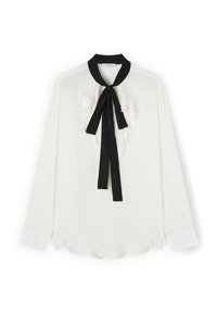 Blusa bianca a maniche lunghe con cravatta nera al collo e dettagli arricciati sul davanti. Tessuto liscio con un leggero riflesso, orlo arrotondato e colletto a contrasto.