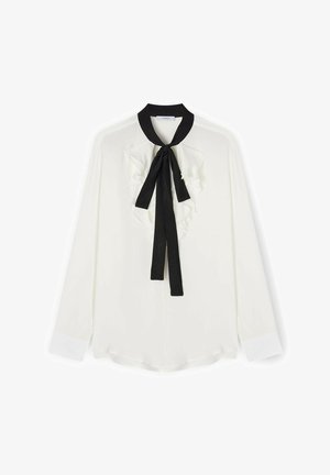 Blusa bianca a maniche lunghe con cravatta nera al collo e dettagli arricciati sul davanti. Tessuto liscio con un leggero riflesso, orlo arrotondato e colletto a contrasto.