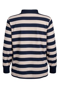 Pikkade varrukatega polo särk, millel vahelduvad tumesinised ja kreemjad horisontaalsed triibud, krae ja soonikkoes mansetid. Puuvillane materjal.