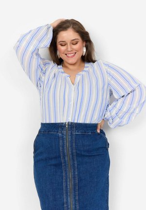 Light blue and white striped blouse with a collar and buttons, paired with a dark denim skirt featuring a front zipper and side pockets.