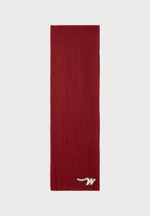 Red knitted scarf featuring a vertical ribbed texture and a silver logo on one end. Measures approximately long and narrow, suitable for winter wear.