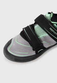 Gray climbing shoe with black straps, mesh accent, and green detailing. Features a rubber sole and contoured design for grip and fit.