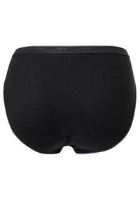Sous-vêtements en coton noir avec une texture lisse, design couvrant intégralement, et une délicate bordure en dentelle le long de la taille et des ouvertures des jambes.