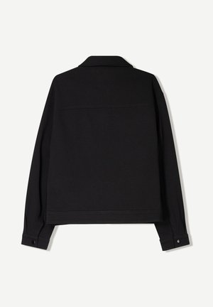 Black fabric jacket with long sleeves, a collar, and buttoned cuffs. Features a solid color and a straight cut design.
