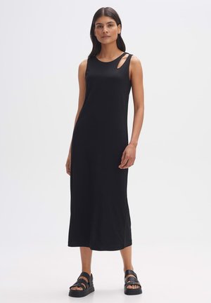 Zwarte mouwloze maxi-jurk met een ronde halslijn en twee kleine uitsparingen op de linkerschouder. Gemaakt van zachte, rekbare stof.