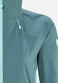 Veste coupe-vent de couleur sarcelle avec des accents bleu clair, dotée d'une fermeture éclair, d'une capuche ajustable et d'un tissu texturé pour la respirabilité.