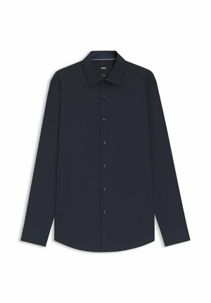 Marineblauw shirt met lange mouwen, een puntige kraag, een voorzijde met knopen en blauwe knoopaccenten. Glad materiaal, standaard pasvorm en geen zichtbare patronen.
