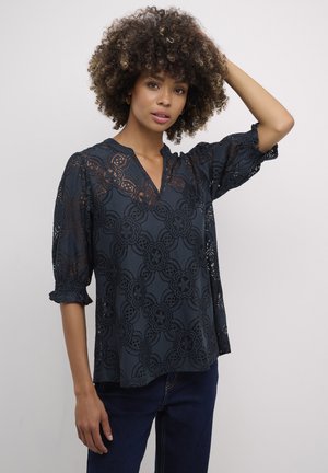 Black lace blouse with a V-neck, three-quarter sleeves, floral pattern, and a relaxed fit, displayed against a neutral background.