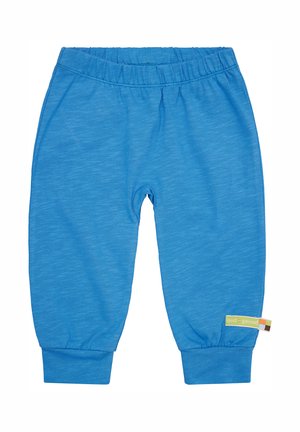 Pantaloni in cotone azzurro chiaro per bambini con cintura elastica, polsini affusolati e una piccola etichetta sul lato con nome del marchio.