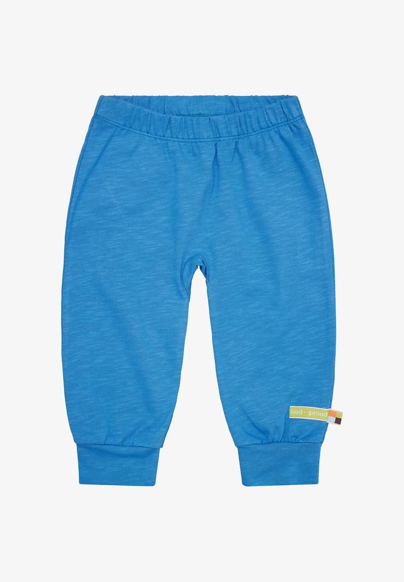 Hellblaue Baumwollhose für Kinder mit elastischem Bund, schmal zulaufenden Bündchen und einem kleinen Etikett an der Seite, das den Markennamen enthält.