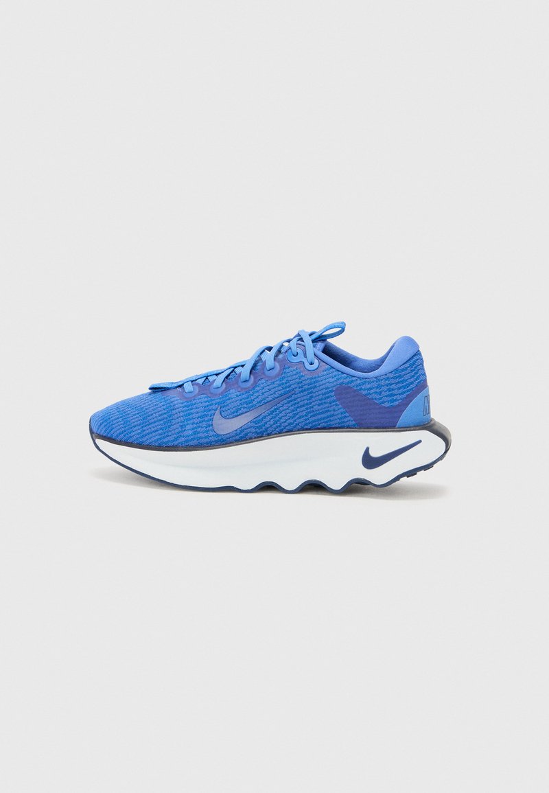Blue athletic shoe with a textured mesh upper, contrasting dark blue accents, a white midsole, and a lightweight, flexible sole design.