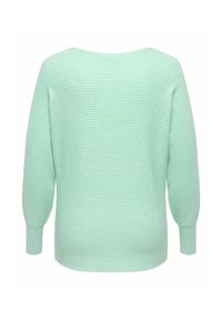 Vaaleanvihreä teksturoitu neule, jossa on resoroitu kangas, leveä pääntie ja pitkät, kapenevat hihat. Takakuvassa näkyvät suunnittelun yksityiskohdat.