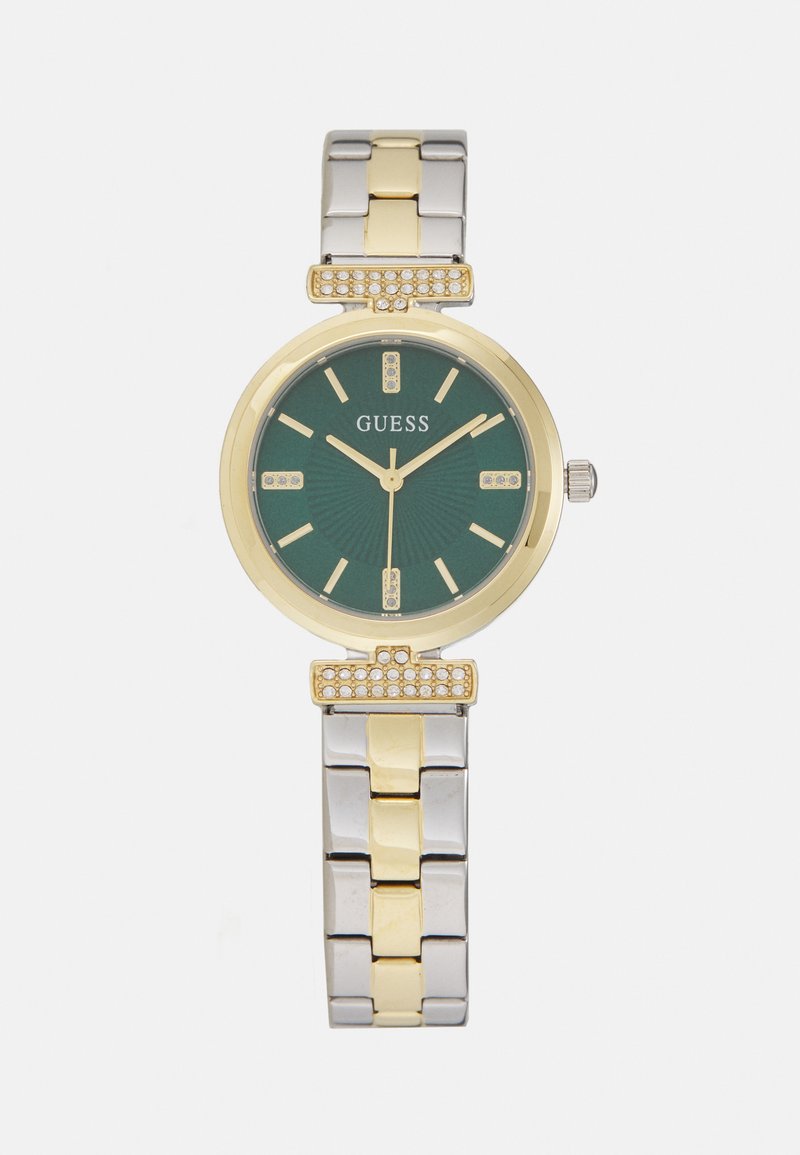 Gold- und Silbermetall-Uhr mit grünem Zifferblatt, das ein strukturiertes Muster, Kristallakzente und ein rundes Gehäuse aufweist. Armband aus Gliedern im Stil eines Armbands.
