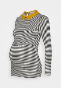 Svart och vit randig graviditetstopp med rund krage i senap. Har långa ärmar och ett elastiskt midjeband för en bekväm passform.