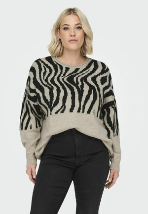 Beige en zwart gestreepte zebra-patroon trui met een losse pasvorm, brede halslijn en lange mouwen, gemaakt van een zachte, textuurrijke brei-stof.