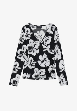 Svart langermet topp med hvitt blomsterdesign, V-hals og samlet detaljer på siden, laget av et teksturert stoff.