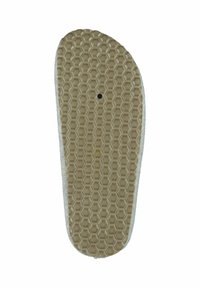 Rubber shoe sole with a honeycomb pattern, featuring a smooth edge, light beige color, and a central perforation.