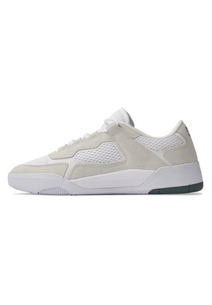 Sneakers featuring a white and light beige suede and mesh upper, with a thick white sole and green accent on the outsole.