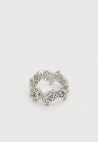 Silver ring with an intricate cut-out fern leaf pattern forming a continuous band on a white background.