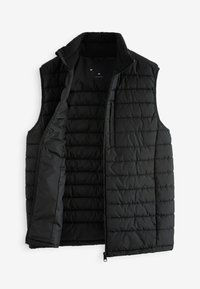 Chaleco acolchado negro con textura de acolchado, cierre completo y cuello alto. El interior cuenta con forro de forro polar, adecuado para superponerse en clima frío.