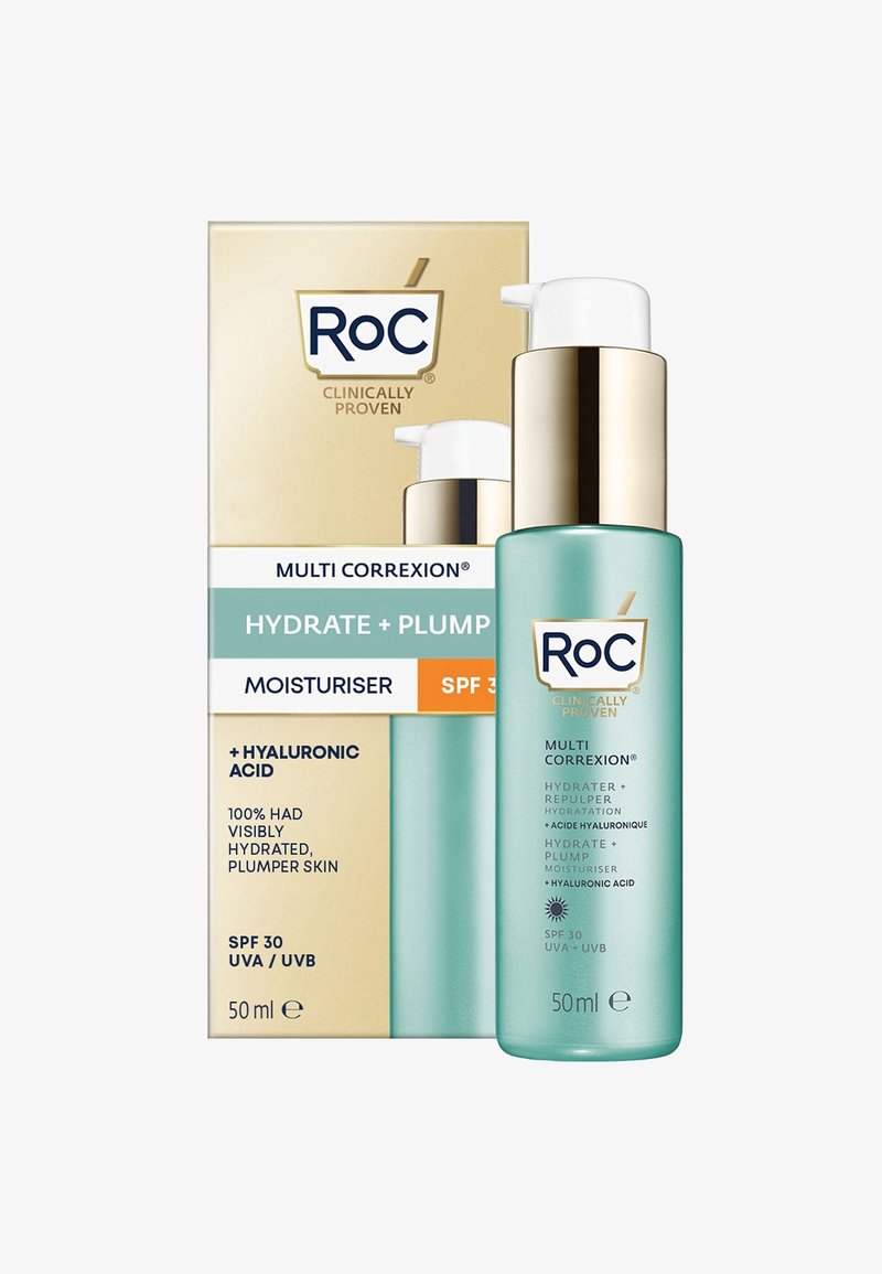 Hydratant dans un flacon en verre turquoise avec un pompe dorée, accompagné d'une boîte beige et dorée présentant les détails du produit et l'indicateur SPF 30.