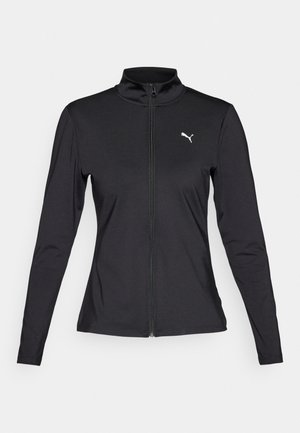 Juoda sportinė striukė su ilgomis rankovėmis, užtrauktuko priekyje, aukštu apykakle ir baltu Puma logotipu kairėje krūtinės pusėje. Pagaminta iš lygaus, elastingo medžiagos.