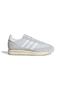 Gray athletic shoe featuring mesh and suede materials, iconic three stripes in white, and a textured rubber sole.