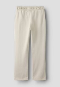 Jasnobeżowe spodnie z mieszanki bawełny z elastycznym paskiem w talii. Prosty krój nogawki z przeszywanym obszyciem, wykonane z miękkiego materiału.