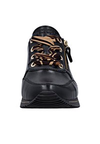 Black leather sneaker featuring gold hardware, a textured sole, and a patterned fabric lace. Includes a side zipper for easy wear.