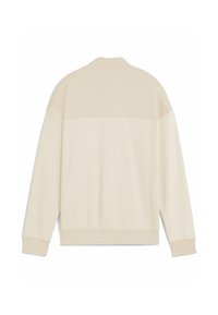 Cremefarvet langærmet sweatshirt med vaffelmønster på den nedre del af ryggen og ærmerne, ribbede manchetter og kant, vist fra bagsiden.
