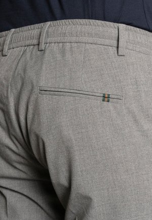 Gray fabric trousers with a textured finish, featuring an elastic waistband and a back pocket with a contrasting green and orange stripe detail.