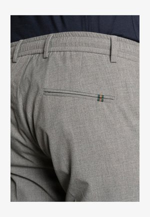 Gray fabric trousers with a textured finish, featuring an elastic waistband and a back pocket with a contrasting green and orange stripe detail.