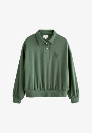 Zaļš džemperis ar apkakli, trīs pogu aizdari, elastīgu apakšdaļu un mazu izšūtu logotipu uz krūškurvja. Mīksta auduma tekstūra.