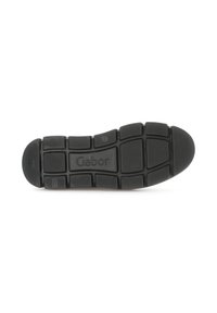 Black rubber shoe sole with a patterned tread, featuring rectangular and circular sections. "Gabor" embossed in the center.